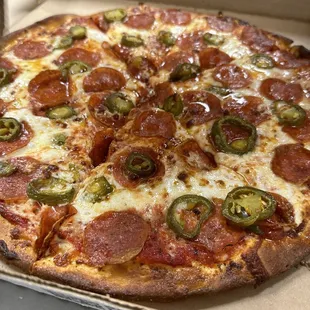 Pepperoni, jalapeño pizza. Garlic buttery cheese crust. Double dipped frie wings.