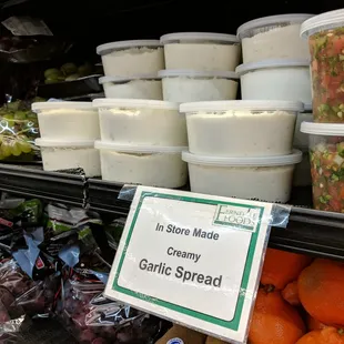 The owners makes garlic sauce in store.