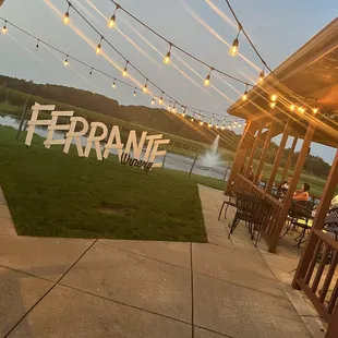 a patio with string lights