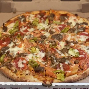 Baked ziti pizza with A FEW extra toppings (meatballs, pepperoni, pepperocinis)