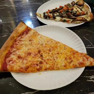 Slice of cheese pizza and portobello pizza