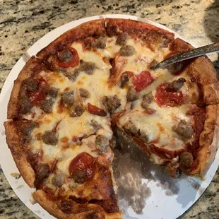 Medium pan with sausage, pepperoni, and extra cheese.