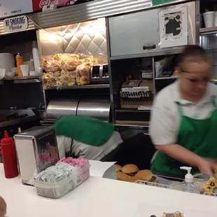 Working it. Double cheeseburger, chili and an orange drink!