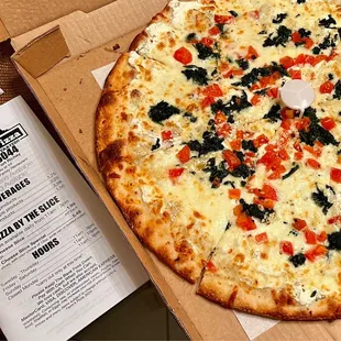 The "Anita".  Spinach, tomato, ricotta, mozzarella, garlic and olive oil.