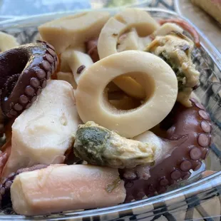 &quot;Imported Seafood Salad&quot;. On a menu in Italy, &quot;fruitti di mare&quot;.
