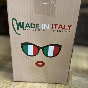 a cardboard box with the logo made in italy