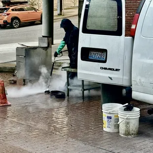 a man cleaning a street