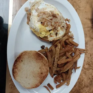 Cheeseburger with fried onions seasoned fries