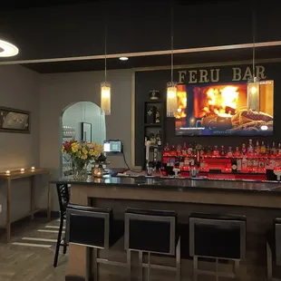 a bar with a television in the background