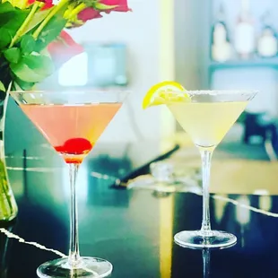 two cocktails on a bar