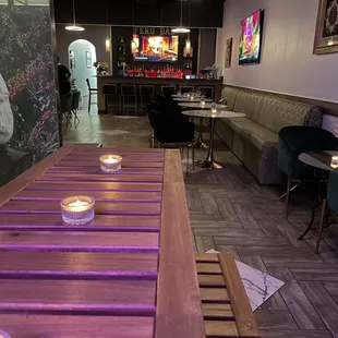 a wooden table with candles on it