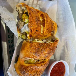 Stromboli with dipping sauce.