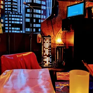 Covid-19 prevention: Hanging plexiglasses where singer(s) would be and microphone covers at each table, and temperature check at the door.