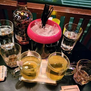 Scotch bottle and hot green teas.