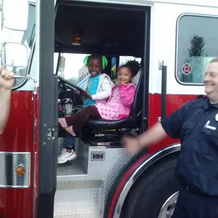 Kevi &amp; Serenity enjoying Speedway Fire Truck!