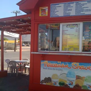 a red building with a menu on it