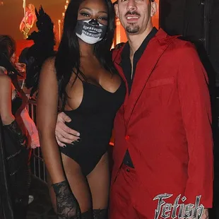 a man and a woman dressed in costumes