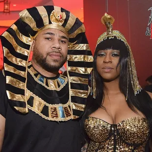 a man and a woman dressed in egyptian costumes