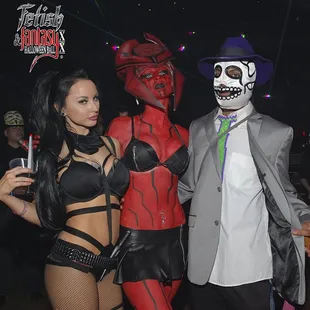 three people dressed in costumes