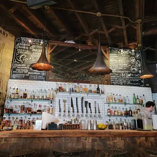 a bar with lots of bottles of alcohol