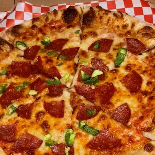 "Unlimited" toppings pepperoni and jalapeños $19