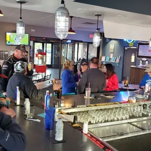people sitting at a bar
