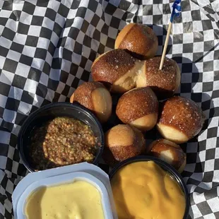 Pretzel bites with 3 different sauces (nacho cheese, Dijon mustard, honey mustard).