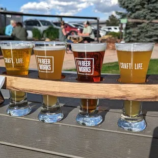 a flight of beers on a table
