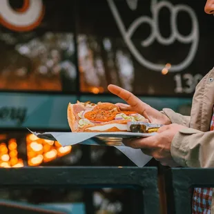 a man holding a tray of food
