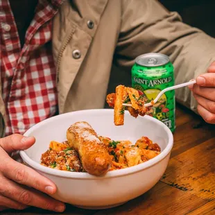 a man eating a bowl of food