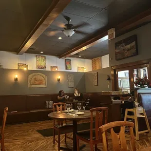 a dining area with tables and chairs