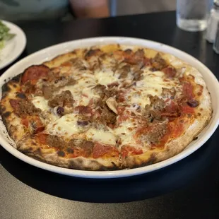 Diavolo pizza with added sausage, and Kalamata olives! Delicious!