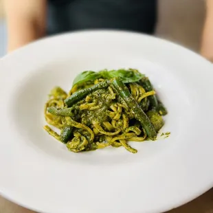 a plate of pasta with spinach