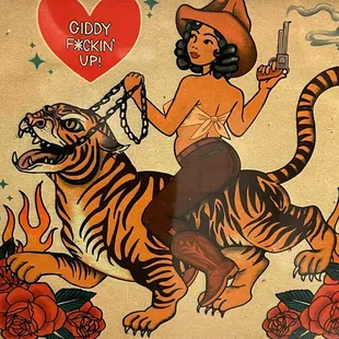 a woman riding a tiger with a gun