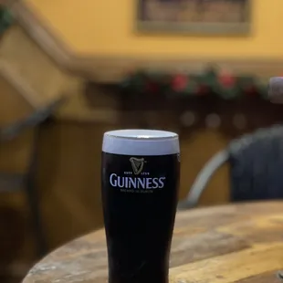 a pint of guinness on a table