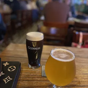 a beer and a book on a table