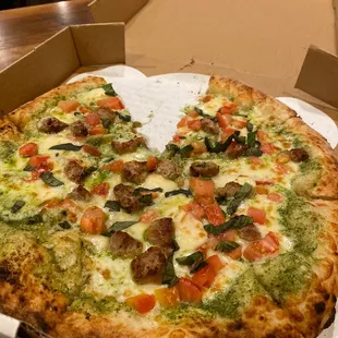Custom pesto sausage pizza