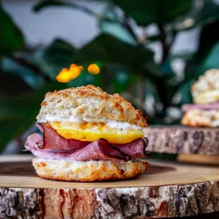Breakfast Sandwich with eggs, ham, garlic aioli on a biscuit. YUM!