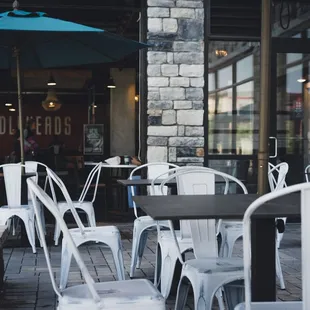 tables and chairs outside a cafe