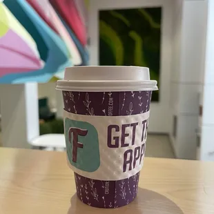 a cup of coffee on a table