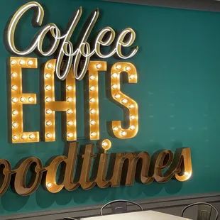 a sign that says coffee hits goodtimes