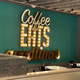 a neon sign in a coffee shop