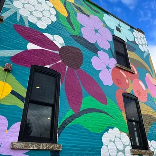 a colorful mural on the side of a building