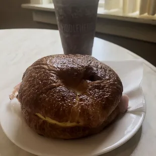 a bagel and a drink on a table