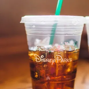 The Classic Disney Parks logo on cups. This is the iced blonde americano.