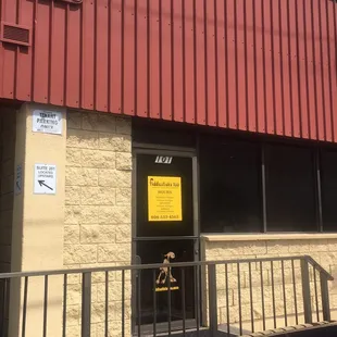 Exterior of store, which is located on a relatively quiet side street with sufficient parking