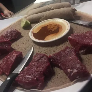 Tira siga  Raw beef with injera