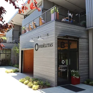 the outside of a building with a balcony