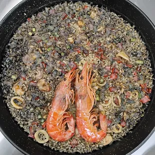 Seafood rice with squid ink and Langoustine