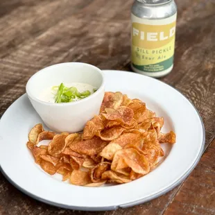 a plate of chips and a bowl of dip